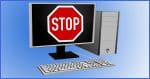 Desktop computer with a Stop sign on the screen.