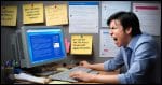 A photorealistic image of a frustrated user sitting at a computer with a blue screen error. The scene should show a cluttered desk with open forums and complaint posts on the monitor, depicting user frustration over unresolved bugs. The background includes sticky notes with various technical error messages. The overall mood is one of frustration and confusion, with the user looking exasperated.