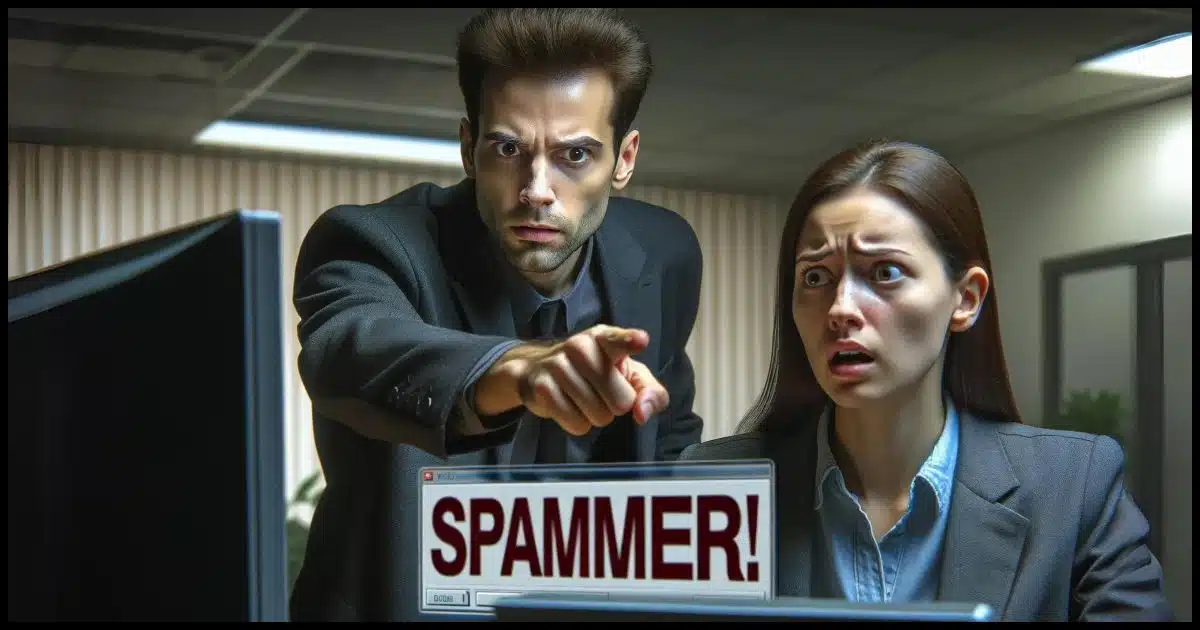 One person pointing accusingly at another person, saying 'SPAMMER!'. The scene is intense, with the accuser looking serious and somewhat angry, while the accused appears surprised and defensive. The background is a nondescript office setting.