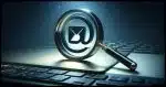 A 16:9 photorealistic image showing a magnifying glass hovering over an email icon. The scene is set on a desktop background, with the magnifying glass closely examining the email icon, symbolizing scrutiny and attention to detail. The email icon should look digital and modern, representing electronic communication, and the magnifying glass should have a realistic and detailed appearance, with a clear lens and metallic frame.