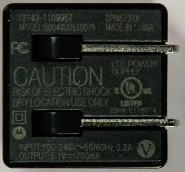 Small faint text on a small USB charger.