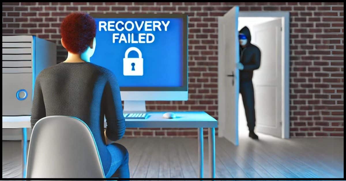 An individual sitting in front of a PC computer screen displaying the message 'Recovery Failed.' In the background, a hacker is peeking around a door, creating a sense of tension and vulnerability.